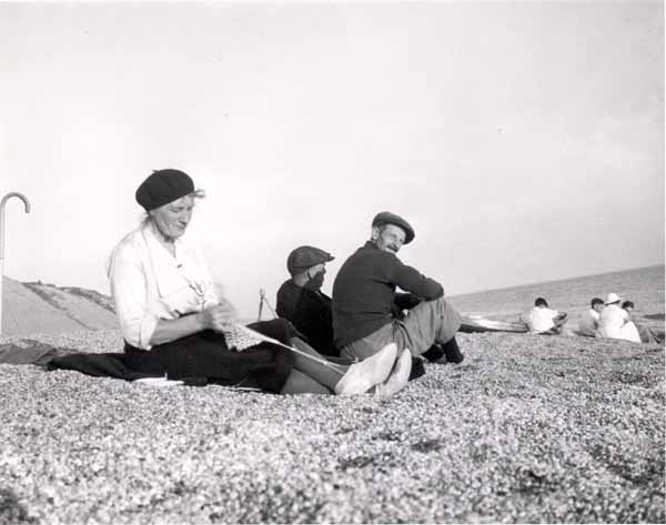 Mabel Hussey braiding on the beach 