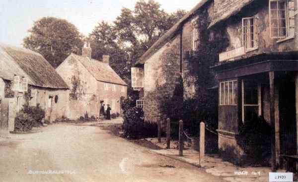 People outside cottage C. 1920