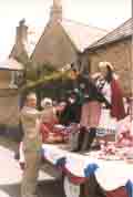 Burton Young Wives float at the Queen's Silver Jubilee (June 1977) in Burton Bradstock. Mary Bailey being congratulated by Laurie Quayle (ITV Presenter)