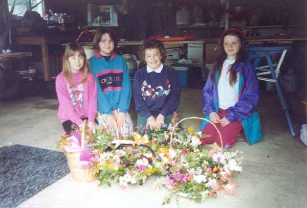Queen & her attendants making posies to sell at the Carnival
