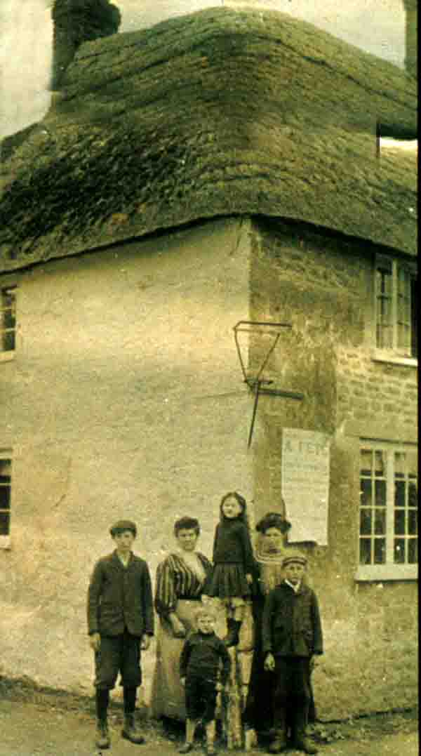 Group on the corner of High Street and Mill Street. Note the poster advertising a Fete.